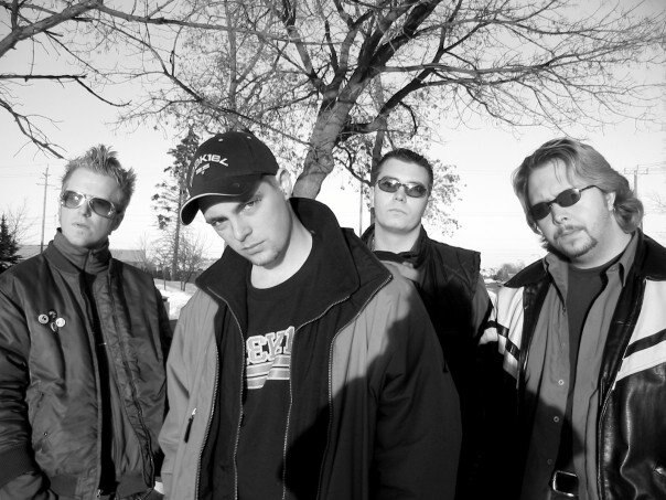 Members of EFA Underground Entertainment posing together outdoors.